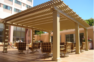 Outdoor patio in Indio, CA, with several chairs arranged around a gazebo, perfect for enjoying the fresh air.