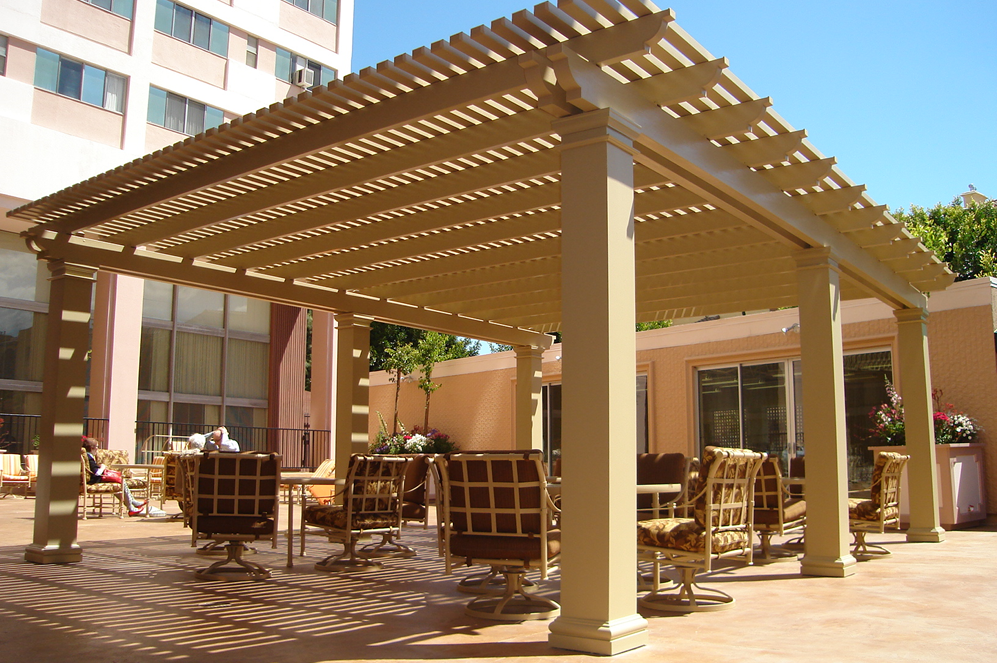 Outdoor patio in Indio, CA, with several chairs arranged around a gazebo, perfect for enjoying the fresh air.